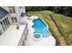 Freeform pool and spa with deck and fire pit at 5200 Blue Stem Ct, Raleigh, NC 27606