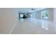 Large living room with tile floors and views into the kitchen area at 5200 Blue Stem Ct, Raleigh, NC 27606
