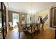 Bright dining room with a large table and chandelier at 5200 Blue Stem Ct, Raleigh, NC 27606