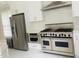 Modern kitchen features stainless steel Viking range and built-in microwave at 5200 Blue Stem Ct, Raleigh, NC 27606