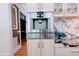 Built-in coffee maker and wine cooler in this stylish kitchen at 5200 Blue Stem Ct, Raleigh, NC 27606