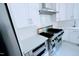 Stainless steel appliances and white cabinetry highlight this kitchen at 5200 Blue Stem Ct, Raleigh, NC 27606