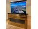 Elegant media room featuring a built-in fireplace and a large, wall-mounted TV at 5200 Blue Stem Ct, Raleigh, NC 27606