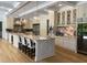 Gourmet kitchen with large island, marble countertops, and high-end appliances at 5200 Blue Stem Ct, Raleigh, NC 27606