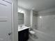 Clean bathroom with dark vanity and tiled floor at 109 Godwin Ct, Sanford, NC 27330