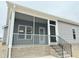 Exterior view of the home, showcasing screened porch and stairs at 144 Emerson Fields Dr, Pikeville, NC 27863