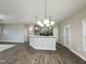 Open concept kitchen with breakfast bar and pendant lighting at 144 Emerson Fields Dr, Pikeville, NC 27863