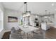 Bright dining area adjacent to the kitchen with modern light fixture at 439 Duncan Creek Rd # Holly Craftsman, Lillington, NC 27546