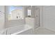 Bathroom with soaking tub and walk-in shower at 110 Merrifield Ln, Garner, NC 27529