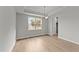 Bright dining room features hardwood floors and a chandelier at 110 Merrifield Ln, Garner, NC 27529