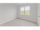 Cozy bedroom with neutral carpeting and large window at 110 Merrifield Ln, Garner, NC 27529