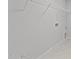 Laundry room with white walls, wire shelving, and tile flooring at 110 Merrifield Ln, Garner, NC 27529