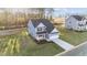Aerial view of two-story home with driveway and landscaping at 110 Merrifield Ln, Garner, NC 27529