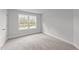 Spacious bedroom with neutral decor and a window at 110 Merrifield Ln, Garner, NC 27529