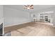 Open living room with kitchen view and fireplace at 110 Merrifield Ln, Garner, NC 27529