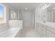 Main bathroom with soaking tub and walk-in shower at 110 Merrifield Ln, Garner, NC 27529