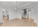 Open concept dining room with kitchen and staircase views at 110 Merrifield Ln, Garner, NC 27529