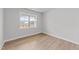 Bright bedroom with large window and light wood flooring at 110 Merrifield Ln, Garner, NC 27529