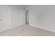 Well-lit bedroom with neutral carpeting and two closets at 110 Merrifield Ln, Garner, NC 27529