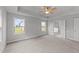 Bright bedroom with ceiling fan and access to bathroom at 110 Merrifield Ln, Garner, NC 27529