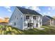 Two story home with gray siding and large backyard at 110 Merrifield Ln, Garner, NC 27529