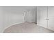 Bedroom with neutral walls, carpet, and access to bathroom at 110 Merrifield Ln, Garner, NC 27529