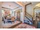 Elegant dining room features a large table, chandelier, and hardwood floors at 3138 Armeria Dr, Apex, NC 27502