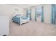 Light filled bedroom with carpeted floors and plenty of natural light at 4301 Auburn Hills Dr, Raleigh, NC 27616