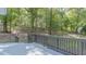 Wooden deck overlooking a backyard with trees at 460 Cedar Ln, Mebane, NC 27302