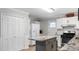 Modern kitchen with granite countertops and white cabinets at 460 Cedar Ln, Mebane, NC 27302