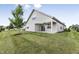House exterior showcasing a covered patio and manicured lawn at 258 Tyree Trl, Burlington, NC 27215