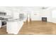 Open concept living area with kitchen island and fireplace at 258 Tyree Trl, Burlington, NC 27215