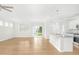 Open concept kitchen with island, hardwood floors, and stainless steel appliances at 258 Tyree Trl, Burlington, NC 27215
