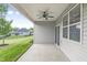 Covered patio with ceiling fan, offering backyard views at 258 Tyree Trl, Burlington, NC 27215