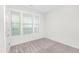Spacious bedroom with window and neutral carpet at 258 Tyree Trl, Burlington, NC 27215