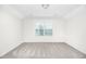 Bright bedroom featuring a large window and neutral wall colors at 258 Tyree Trl, Burlington, NC 27215