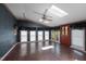 Sunroom with brick flooring, multiple windows, and a door to outdoors at 2517 Oakes Plantation Dr, Raleigh, NC 27610