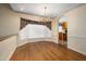 Formal dining room with hardwood floors and a bay window at 2517 Oakes Plantation Dr, Raleigh, NC 27610