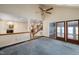 Spacious living room with vaulted ceiling, carpeting, and access to other rooms at 2517 Oakes Plantation Dr, Raleigh, NC 27610