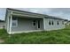 Gray house exterior with covered back porch and grassy yard at 167 Lotus Ave, Smithfield, NC 27577