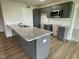 Modern kitchen with granite countertops and gray cabinets at 167 Lotus Ave, Smithfield, NC 27577