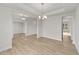 Open dining room with hardwood floors and access to kitchen at 90 Merrifield Ln, Garner, NC 27529