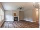 Spacious living room with hardwood floors, a fireplace, and ceiling fan at 6913 Old Jefferson Davis Hwy, Cameron, NC 28326