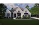 Two-story craftsman home with a front porch and landscaping at 129 Crestridge Place, Durham, NC 27705
