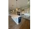 Modern kitchen with large island, stainless steel appliances, and light cabinets at 317 Kavanaugh Rd, Wake Forest, NC 27587