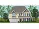 Two-story home with a light yellow exterior and white garage door at 116 Augusta Pond Way # 140, Raleigh, NC 27603