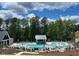 Resort-style community pool with ample lounge chairs and cabana at 116 Augusta Pond Way # 140, Raleigh, NC 27603