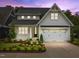 Two story home with white siding and a two car garage at 414 S Cross St, Youngsville, NC 27596