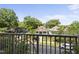 Balcony overlooking a tree-lined street and houses at 222 Glenwood Ave # 307, Raleigh, NC 27603