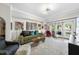 Bright and airy living room with hardwood floors, large windows, and eclectic decor at 222 Glenwood Ave # 307, Raleigh, NC 27603